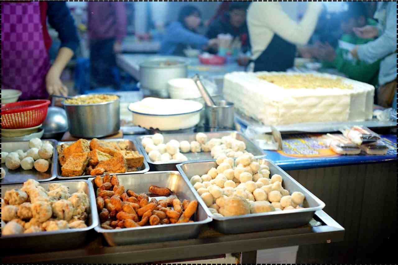 Delicious grilled chicken skewers on a street food vendor's cart